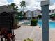 Community spa and pool with lounge chairs at 3480 Soho St # 101, Orlando, FL 32835