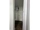 Small laundry room with water heater and vinyl flooring at 1526 Lakewood Rd, Davenport, FL 33837