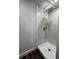 Walk-in shower with hexagonal tiles and modern fixtures at 1526 Lakewood Rd, Davenport, FL 33837