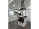 Modern kitchen with white cabinets and island at 1526 Lakewood Rd, Davenport, FL 33837