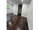 Bedroom with dark laminate flooring and an ensuite bathroom at 1526 Lakewood Rd, Davenport, FL 33837