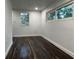 Spacious bedroom with dark laminate wood flooring and neutral walls at 1526 Lakewood Rd, Davenport, FL 33837