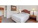Comfortable bedroom with a double bed and wood nightstands at 1370 Tuscan Terrace # 2205, Davenport, FL 33896