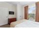 Bedroom with a queen bed, dresser, and TV at 1370 Tuscan Terrace # 2205, Davenport, FL 33896