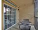 Screened balcony with sliding glass doors and table and chairs at 1370 Tuscan Terrace # 2205, Davenport, FL 33896