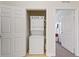 Convenient laundry room with a stacked washer and dryer at 1370 Tuscan Terrace # 2205, Davenport, FL 33896