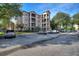 Three-story building with parking lot and landscaping at 1370 Tuscan Terrace # 2205, Davenport, FL 33896