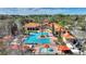 Community pool and clubhouse with surrounding buildings at 1370 Tuscan Terrace # 2205, Davenport, FL 33896