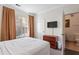 Cozy bedroom with a double bed and ensuite bathroom at 1370 Tuscan Terrace # 2205, Davenport, FL 33896