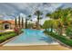 Inviting pool area with lush landscaping and palm trees at 1370 Tuscan Terrace # 2205, Davenport, FL 33896