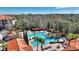Resort-style pool and surrounding buildings, with distant golf course at 1370 Tuscan Terrace # 2205, Davenport, FL 33896