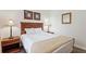 Bedroom with a double bed, nightstands, and lamps at 1370 Tuscan Terrace # 2205, Davenport, FL 33896