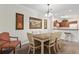 Bright dining area with a rustic farmhouse table and chairs at 1370 Tuscan Terrace # 2205, Davenport, FL 33896
