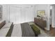 Main bedroom with double closets and wood-look floors at 5587 Devonbriar Way # J207, Orlando, FL 32822