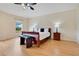 Bright bedroom with hardwood floors and a comfortable sitting area at 4833 Lakes Edge Ln, Kissimmee, FL 34744