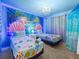 Themed bedroom with twin beds and mermaid decor at 1999 Tropical Palms Cir, Kissimmee, FL 34747