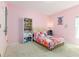 Fun bedroom with a pink color scheme, and plenty of storage at 122 Blue Cypress Drive, Davenport, FL 33837
