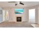 Spacious living room with fireplace and carpet flooring at 320 Black Oak Ct # 107, Altamonte Springs, FL 32701