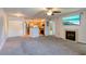 Open living room with fireplace, kitchen and ample space at 320 Black Oak Ct # 107, Altamonte Springs, FL 32701