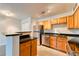 Modern kitchen features stainless steel appliances and granite countertops at 320 Black Oak Ct # 107, Altamonte Springs, FL 32701