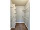 Large walk-in closet with shelving and hanging rods at 320 Black Oak Ct # 107, Altamonte Springs, FL 32701