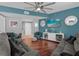 Living Room with hardwood floors, teal walls, and comfortable seating at 322 E Central Blvd # 710, Orlando, FL 32801