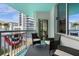 Private balcony offering city views and comfortable seating at 322 E Central Blvd # 710, Orlando, FL 32801