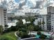 Aerial view of condo complex, pool, and lake at 6165 Carrier Dr # 3802, Orlando, FL 32819