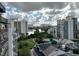 Aerial view of condo complex, pool and lake at 6165 Carrier Dr # 3802, Orlando, FL 32819