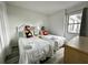Twin bedroom with Mickey Mouse decor and window at 6165 Carrier Dr # 3802, Orlando, FL 32819