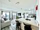 Modern white kitchen with quartz countertops and stainless steel appliances at 6165 Carrier Dr # 3802, Orlando, FL 32819