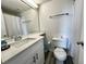 Bathroom with white vanity, toilet and shower/tub combo at 6165 Carrier Dr # 3802, Orlando, FL 32819