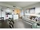 Open concept living area with modern furniture and city view at 6165 Carrier Dr # 3802, Orlando, FL 32819