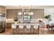 Modern kitchen with light taupe cabinets, white countertops, and hardwood floors at 3304 Harrison Ave, Orlando, FL 32804