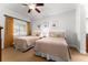 Bedroom with two twin beds and ceiling fan at 1350 Centre Court Ridge # 103, Reunion, FL 34747