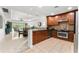 Modern kitchen features stainless steel appliances and ample cabinetry at 1350 Centre Court Ridge # 103, Reunion, FL 34747