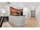Open concept kitchen and hallway with modern finishes and ample natural light at 1350 Centre Court Ridge # 103, Reunion, FL 34747