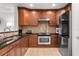 Updated kitchen featuring stainless steel appliances and granite countertops at 1350 Centre Court Ridge # 103, Reunion, FL 34747