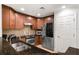 Kitchen boasts stainless steel appliances and double sink with granite countertops at 1350 Centre Court Ridge # 103, Reunion, FL 34747