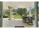 Enjoy the view from this covered patio with a table and chairs at 1350 Centre Court Ridge # 103, Reunion, FL 34747