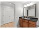 Bathroom with granite vanity and a large mirror at 1350 Centre Court Ridge # 103, Reunion, FL 34747