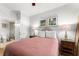 Bedroom with a full-size bed and nightstands at 1350 Centre Court Ridge # 103, Reunion, FL 34747