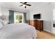 Main bedroom with private balcony and large TV at 1350 Centre Court Ridge # 103, Reunion, FL 34747