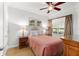 Bedroom with a full-size bed and desk at 1350 Centre Court Ridge # 103, Reunion, FL 34747