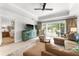 Comfortable living room with patio access and sectional sofa at 1350 Centre Court Ridge # 103, Reunion, FL 34747
