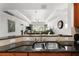 Kitchen with granite countertops and stainless steel double sink at 1350 Centre Court Ridge # 103, Reunion, FL 34747