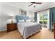 Spacious bedroom with private balcony and ensuite bathroom at 1350 Centre Court Ridge # 103, Reunion, FL 34747
