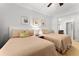 Bedroom with two twin beds and ceiling fan at 1350 Centre Court Ridge # 103, Reunion, FL 34747