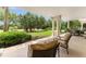 Covered patio with seating area, perfect for outdoor relaxation at 1350 Centre Court Ridge # 103, Reunion, FL 34747