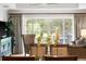 Open dining room with glass table and access to the patio at 1350 Centre Court Ridge # 103, Reunion, FL 34747